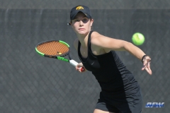DALLAS, TX - FEBRUARY 4: Iowa player hits a forehand during the SMU women's tennis match vs Iowa on February 4, 2018, at the SMU Tennis Complex, Turpin Stadium & Brookshire Family Pavilion in Dallas, TX. (Photo by George Walker/DFWsportsonline)
