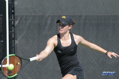 DALLAS, TX - FEBRUARY 4: Iowa player hits a forehand during the SMU women's tennis match vs Iowa on February 4, 2018, at the SMU Tennis Complex, Turpin Stadium & Brookshire Family Pavilion in Dallas, TX. (Photo by George Walker/DFWsportsonline)