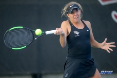 DALLAS, TX - FEBRUARY 09: UCF player hits a forehand during the SMU women's tennis match vs UCF on February 9, 2018, at the SMU Tennis Complex, Turpin Stadium & Brookshire Family Pavilion in Dallas, TX. (Photo by George Walker/DFWsportsonline)