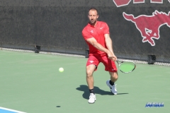 DALLAS, TX - MARCH 16: SMU women’s tennis Assistant Coach Neil Kenner hits a backhand during the SMU women's tennis match vs Troy on March 16, 2018, at the SMU Tennis Complex, Turpin Stadium & Brookshire Family Pavilion in Dallas, TX. (Photo by George Walker/DFWsportsonline)
