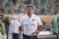 DENTON, TX - SEPTEMBER 01: North Texas Mean Green head coach Seth Littrell jogs off the field at halftime during the game between North Texas and SMU on September 1, 2018 at Apogee Stadium in Denton, TX. (Photo by George Walker/Icon Sportswire)