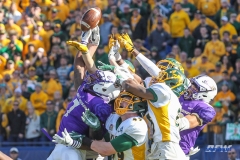 FRISCO, TX - JANUARY 6: Players reach for the ball on a desperation pass attempt by James Madison during the NCAA FCS Championship football game between North Dakota State and James Madison on January 6, 2018 at Toyota Stadium in Frisco, TX. (Photo by George Walker/DFWsportsonline)
