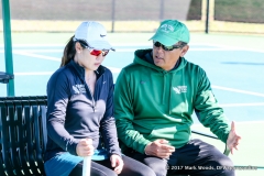 Sujay Lama coaches Minying Liang during a court change during the women's tennis match between North Texas and Nevada on February 25, 2017 at Waranch Tennis Complex in Denton, TX.