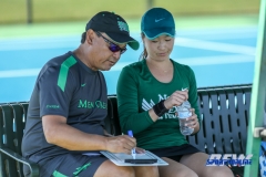 Denton, TX - March 3: Head Coach Sujay Lama discusses strategy with Haruka Sasaki during the UNT Mean Green Women’s Tennis dual match against the University of Houston at the Waranch Tennis Complex in Denton, TX. (Photo by Mark Woods/DFWsportsonline)