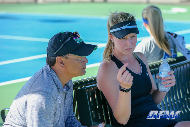 Denton, TX - March 7: Head Coach Sujay Lama and Ivana Babić discuss the last game during the UNT Mean Green Women’s Tennis dual match against the Middle Tennessee State University at the Warch Tennis Complex in Denton, TX. (Photo by Mark Woods/DFWsportsonanline)