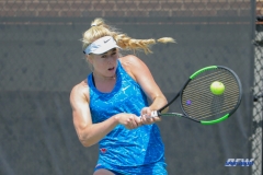 DALLAS, TX - MARCH 31: Nicole Petchey hits a backhand during the SMU women's tennis match vs ECU on March 31, 2018, at the SMU Tennis Complex, Turpin Stadium & Brookshire Family Pavilion in Dallas, TX. (Photo by George Walker/DFWsportsonline)