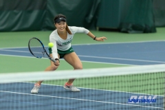Plano, TX - April 14: Haruka Sasaki volleys during the North Texas Women’s Tennis dual match against the University of Arlington at the Lifetime Plano Tennis facility in Plano, TX. (Photo by Mark Woods/DFWsportsonline)