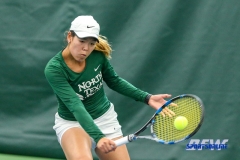 Plano, TX - April 14: Minying Liang hits a backhand during the North Texas Women’s Tennis dual match against the University of Arlington at the Lifetime Plano Tennis facility in Plano, TX. (Photo by Mark Woods/DFWsportsonline)