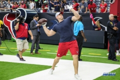 HOUSTON, TX - AUGUST 30: Houston Texans defensive end J.J. Watt (99) passes the football with fans before the preseason game between the Houston Texans and Dallas Cowboys on August 30, 2018, at NRG Stadium in Houston, TX. (Photo by George Walker/DFWsportsonline)