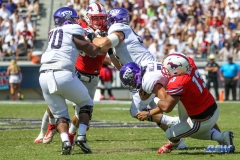 DALLAS, TX - SEPTEMBER 16: TCU Horned Frogs quarterback Kenny Hill (7) is sacked by Southern Methodist Mustangs defensive lineman Tyeson Neals (13) during the game between the SMU Mustangs and TCU Horned Frogs on September 16, 2017, at Amon G. Carter Stadium in Fort Worth, Texas.  (Photo by George Walker/DFWsportsonline)