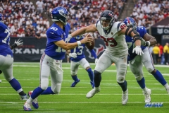 HOUSTON, TX - SEPTEMBER 23: Houston Texans defensive end J.J. Watt (99) pressures New York Giants quarterback Eli Manning (10) during the game between the Houston Texans and New York Giants on September 23, 2018, at NRG Stadium in Houston, TX. (Photo by George Walker/DFWsportsonline)