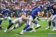 HOUSTON, TX - SEPTEMBER 23: Houston Texans defensive end J.J. Watt (99) sacks New York Giants quarterback Eli Manning (10) during the game between the Houston Texans and New York Giants on September 23, 2018, at NRG Stadium in Houston, TX. (Photo by George Walker/DFWsportsonline)