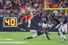 HOUSTON, TX - OCTOBER 08: Kansas City Chiefs tight end Travis Kelce (87) leaps over Houston Texans free safety Andre Hal (29) during the game between the Houston Texans and Kansas City Chiefs on October 8, 2017, at NRG Stadium in Houston, TX. (Photo by George Walker/DFWsportsonline)