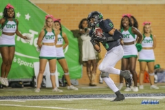 DENTON, TX - OCTOBER 14: North Texas Mean Green wide receiver Jalen Guyton (9) makes a catch for a touchdown during the game between the North Texas Mean Green and UTSA Roadrunners on October 14, 2017, at Apogee Stadium in Denton, Texas. (Photo by George Walker/DFWsportsonline)