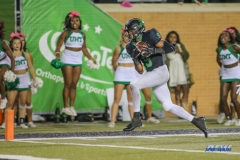 DENTON, TX - OCTOBER 14: North Texas Mean Green wide receiver Jalen Guyton (9) makes a catch for a touchdown during the game between the North Texas Mean Green and UTSA Roadrunners on October 14, 2017, at Apogee Stadium in Denton, Texas. (Photo by George Walker/DFWsportsonline)