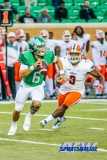 Denton, TX - November 11: North Texas Mean Green quarterback Mason Fine (6) pursued by UTEP linebacker Johnny Jones (8) during the game between the North Texas Mean Green and UTEP Miners (Photo by Mark Woods/DFWsportsonline)