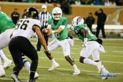 Denton, TX - November 18: North Texas quarterback Mason Fine (6) hands off to running back Nic Smith (21) during the game between the North Texas Mean Green and Army West Point Black Knights (Photo by Mark Woods/DFWsportsonline)