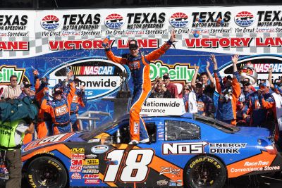 Kyle Busch celebrates in Victory Lane after winning the NASCAR Nationwide Series O’Reilly 300 at Texas Motor Speedway. Photo by George Walker.