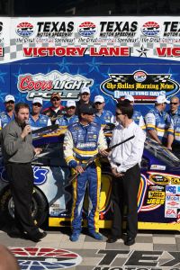 David Reutimann is presented a Beretta Shotgun after winning the pole for the 2009 Samsung Mobile 500. Photo by George Walker.