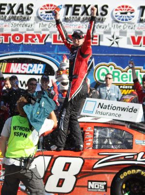 Kyle Busch celebrates in Victory Lane at Texas Motor Speedway. Photo by George Walker.