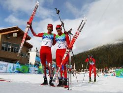 WHISTLER, BC - FEBRUARY 25: Johnny Spillane (L) of the United States celebrates winning silver and Bill Demong of the United States gold in the Nordic Combined Individual LH/10 km on day 14 of the 2010 Vancouver Winter Olympics at Whistler Olympic Park Ski Jumping Stadium on February 25, 2010 in Whistler, Canada. (Photo by Lars Baron/Bongarts/Getty Images)