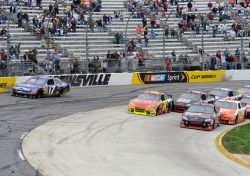 After starting the green-white-checkered finish in fourth position, Denny Hamlin pushed his way to the front of the field and took the lead when Matt Kenseth cut across the field but couldnt stay in the groove. Credit: John Harrelson/Getty Images for NASCAR