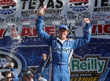 Carl Edwards celebrates in Victory Lane after winning the 2010 NASCAR Nationwide Series O'Reilly Auto Parts Challenge at Texas Motor Speedway. Photo by George Walker.