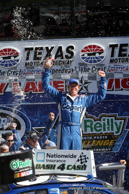 Carl Edwards celebrates in Victory Lane after winning the 2010 NASCAR Nationwide Series O'Reilly Auto Parts Challenge at Texas Motor Speedway. Photo by George Walker.
