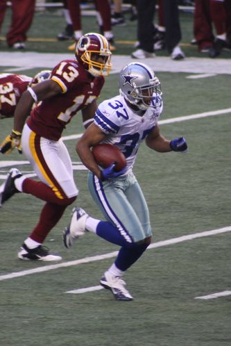 Bryan McCann returns a kick for the Dallas Cowboys. Photo by George Walker