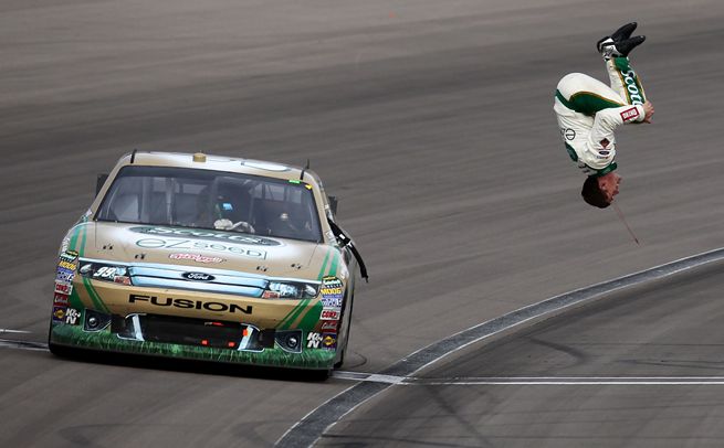 Carl Edwards does his trademark backflip after winning for the second time at Las Vegas Motor Speedway. Credit: Jonathan Ferrey/Getty Images