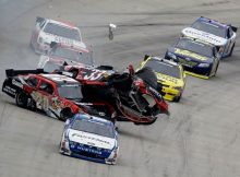 Carl Edwards leads as Joey Logano (No. 20) collides with Clint Bowyer (No. 33) at the end of the NASCAR Nationwide Series 5-hour Energy 200 on Saturday at Dover International Speedway in Dover, Del. Credit: Todd Warshaw/Getty Images for NASCAR