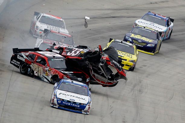 Carl Edwards leads as Joey Logano (No. 20) collides with Clint Bowyer (No. 33) at the end of the NASCAR Nationwide Series 5-hour Energy 200 on Saturday at Dover International Speedway in Dover, Del. Credit: Todd Warshaw/Getty Images for NASCAR