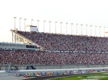 Kyle Busch takes the green flag in front of a sold out crowd for the inaugural Quaker State 400 at Kentucky Speedway. Credit: Andy Lyons/Getty Images for NASCAR